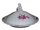 Royal 
Copenhagen 
Purpur Flower 
Curved, large 
lidded bowl 
with a putti 
figurine on the 
...