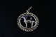 Round pendant 
of gold with 
the sign of 
Capricorn, made 
in 14 carat 
gold. The gold 
jewelery is ...