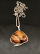 Amber pendant 
3.9 x 3.9 cm. 
mounted in 
sterling silver 
item no. 545199