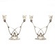 Pair of Georg 
Jensen 
sterlingsilver 
candelabra 
designed by 
Harald Nielsen
#619. After 
1945
H: ...