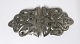 A. Dragsted. 
Silver belt 
buckle (826). 
Viking style. 
Length 12 cm. 
Width 5.5 cm