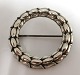 Georg Jensen. 
Silver brooch 
(925). Design 
Sigvard 
Bernadotte. 
Model 301. 
Diameter 35 mm. 
...