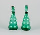 A pair of 
decanters in 
green art glass 
from a Swedish 
glassworks. 
Mouth-blown in 
Art Deco ...