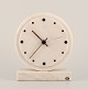 Yxhult Sten, Sweden. Art Deco tabletop clock in white marble. Brass hands.