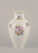 Herend, Hungary. Large porcelain vase hand-painted with polychrome flower motifs 
and gold edge.