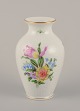 Herend, 
Hungary. 
Porcelain vase 
hand-painted 
with polychrome 
flower motifs 
and gold ...