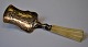 Small silver 
spatula with 
rococo 
decoration of a 
woman churning 
butter, 19th 
century. Bone 
...