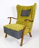Armchair by a Danish master carpenter in dark polished wood upholstered in gray and yellow ...