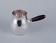 Georg Jensen creamer in sterling silver with an ebony handle.