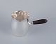 Georg Jensen 
pitcher in 
sterling silver 
with an ebony 
...