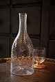 Swedish 1800s 
mouth-blown 
water carafe in 
twisted glass. 
H:28cm. 
Dia.:11cm.