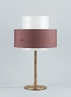 Luxus, Sweden. 
Large table 
lamp in brass 
with a shade in 
plastic and 
brown fabric.
In beautiful 
...