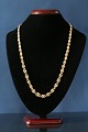 Beautiful gold 
chain with a 
continuous knot 
in 14 carat 
gold. The 
individual 
links are 
detailed ...