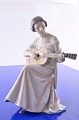 Bing & 
Grondahl. 
Figurine B&G 
Woman with 
guitar no. 
1684. Height 24 
cm. 2. quality, 
fine ...