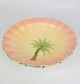 Large pink and 
sand colored 
porcelain plate 
with a motif of 
a palm tree 
made in Italy.
H:5 Dia:24
