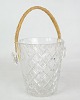 Crystal glass 
ice bucket with 
braided handle 
from around the 
1930s.
H:14 Dia:12.5
