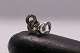 Beautiful ear studs in 14 carat white gold, shaped like a figure 8 with inlaid brilliants. Very ...