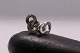 Beautiful ear 
studs in 14 
carat white 
gold, shaped 
like a figure 8 
with inlaid 
brilliants. 
Very ...