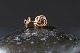 Beautiful studs 
in 14 carat 
gold, made in 
detailed soft 
shapes. In the 
middle is a 
beautiful ...