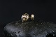 Beautiful studs in 14 carat gold, with inlaid brilliants and a nice pattern. The ear studs are ...