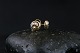 Beautiful studs 
in 14 carat 
gold, with 
inlaid 
brilliants and 
a nice pattern. 
The ear studs 
are ...