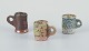 Danish studio 
ceramicist.
Three unique 
miniature 
ceramic mugs.
Decorated with 
various ...