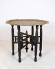 Indian tray table in the form of a brass tray and wooden base with carvings from around the ...