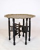 Indian tray 
table in the 
form of a brass 
tray and wooden 
base with 
carvings from 
around the ...