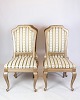 Set of four antique rococo chairs in gilded wood with striped fabric from around the ...