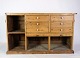 Antique grocery 
counter in 
light pine with 
shelves and 
drawers in 
light patina 
from around ...