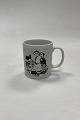 Monthly mug in 
faience for 
September - 
SEASON DEBUT. 
Designed by 
Bjørn Wiinblad 
for Nymølle. In 
...