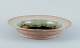 Nils Kähler for 
Kähler. Large 
ceramic bowl in 
modernist 
design.
Uranium glaze 
with blue and 
...