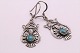 These beautiful 
earrings in 
silver with 
inlaid 
turquoise are 
beautifully 
made with many 
details. ...