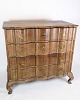 Baroque chest of drawers in oak with brass fittings decorated with wood carvings from the period ...