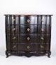 Chest of drawers in stained oak with brass fittings decorated with wood carvings from the period ...