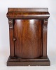 Entrance 
furniture in 
mahogany with a 
door decorated 
with carvings 
from around the 
...