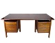Freestanding desk of Danish design made of rosewood with drawers and shelves from around the ...