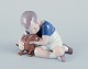 Ingeborg Plockross Irminger for Bing & Grøndahl, porcelain figurine of a boy 
with a dachshund.