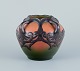 Ipsens, Denmark. Ceramic vase in Art Nouveau style.Design depicting plant growth. Glaze in ...