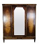 Wardrobe in 
polished birch 
wood with a 
faceted mirror 
in the middle 
and 3 doors and 
shelves from 
...