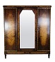 Wardrobe in 
polished birch 
wood with a 
faceted mirror 
in the middle 
and 3 doors and 
shelves from 
...