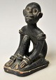 African clay figure, 19th/20th century. A seated man. Black painted red clay. H.: 12.3 ...