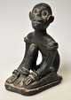 African clay 
figure, 
19th/20th 
century. A 
seated man. 
Black painted 
red clay. H.: 
12.3 ...