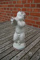 Danish ceramics 
& pottery by 
Michael 
Andersen, 
Bornholm, 
Denmark.
Naked boy with 
trumpet in a 
...