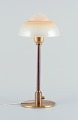 Fog & Mørup. Table lamp with a stem in patinated brass, fitted with a "Spejlæg" (Fried Egg) ...