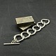 Length 22 cm.
Width 4 cm.
Heavy bracelet 
in 
silver-plated 
metal from the 
1960s.
It consists 
...