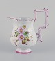 Emile Gallé (style of). Pitcher in faience with motifs of flowers and insects.