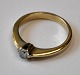 18 carat gold 
ring with 
brilliant, 20th 
century 
Stamped. Ring 
size: 52/52. 
Diamond size: 
3/16 Carat.