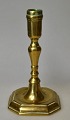 Baroque Danish brass candlestick, 18th century. On eight angular feet. H: 17.5 cm.