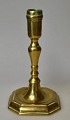 Baroque Danish 
brass 
candlestick, 
18th century. 
On eight 
angular feet. 
H: 17.5 cm.